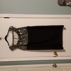 Black dress with decorative green details on top